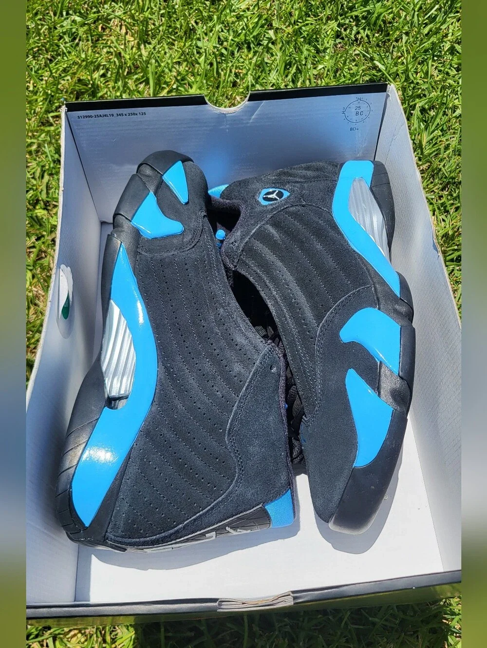 Air Jordan 14 Retro Black and University Blue Sneakers